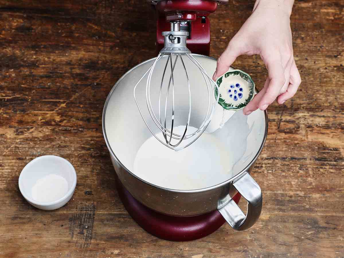 Pouring Clear Vanilla into Cream