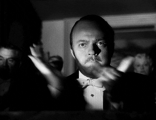 A black-and-white GIF of Charles Foster Kane clapping slowly with a stern, unimpressed expression. A black-and-white GIF of Charles Foster Kane clapping slowly with a stern, unimpressed expression.