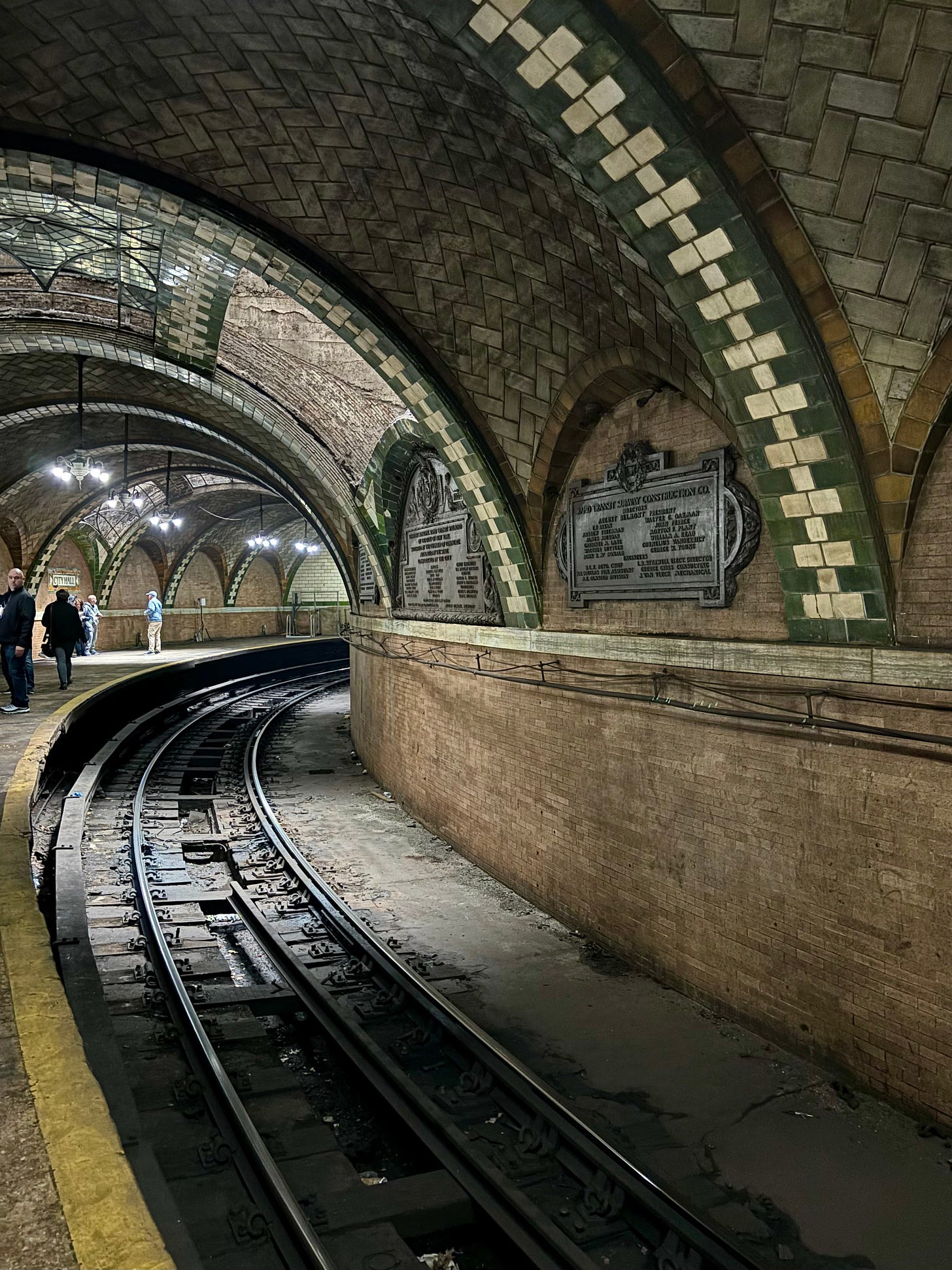 The platform from the other side. There are some decorative skylights still in place on the ceiling and two engraved seals on the walls.