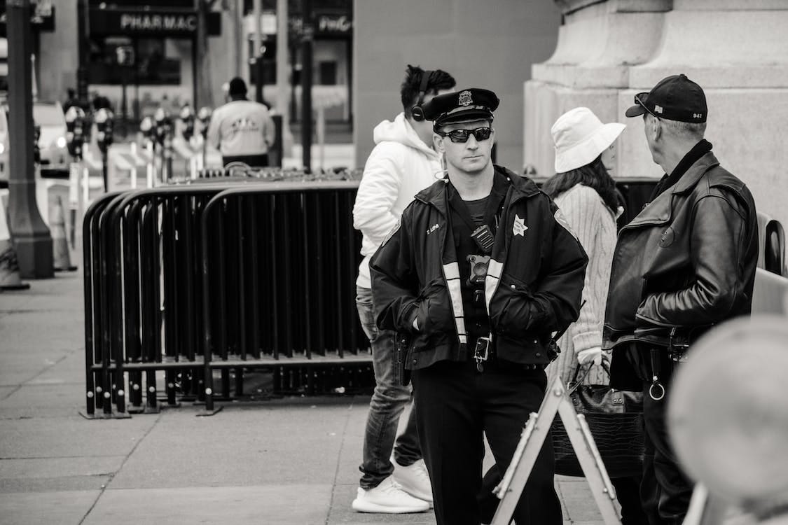 police officers on the sidewalk, Virginia business owner is raided by police police officers on the sidewalk, Virginia business owner is raided by police