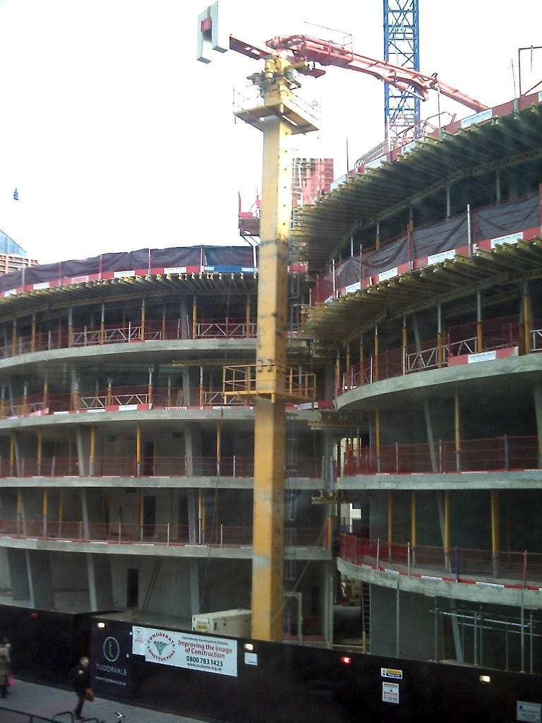 concrete pump on building construction site concrete pump on building construction site