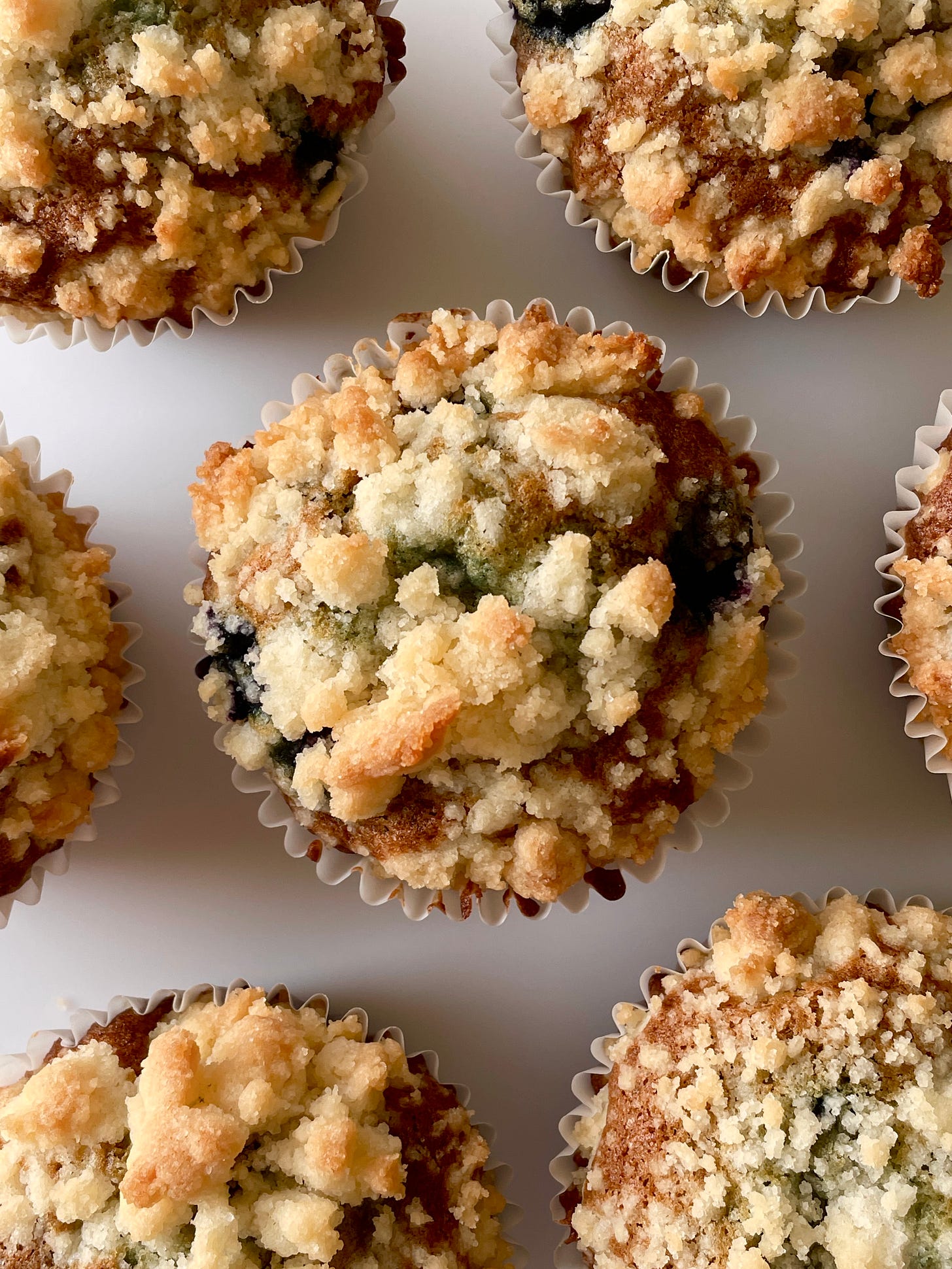 tops of streusel-topped blueberry muffins