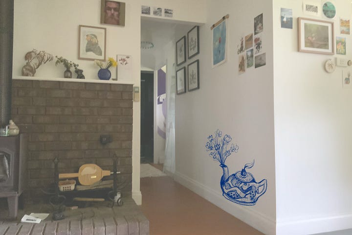 Drawing on the wall with blue pencil.