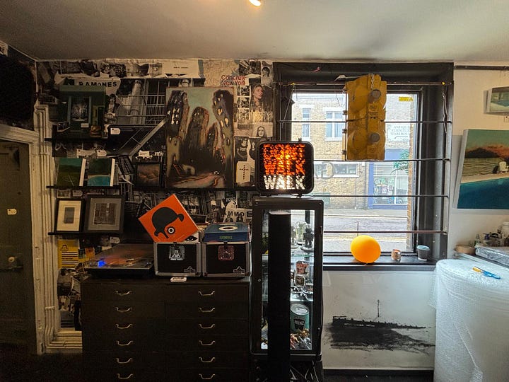 From a quiet street in Deal to the narrow hallway and intimate rooms beyond, the Walk Don't Walk Gallery invites visitors to step inside, be nosey, and discover an art space where humour, conversation and curiosity shape the experience as much as the works on the walls. — © Kent Chronicles