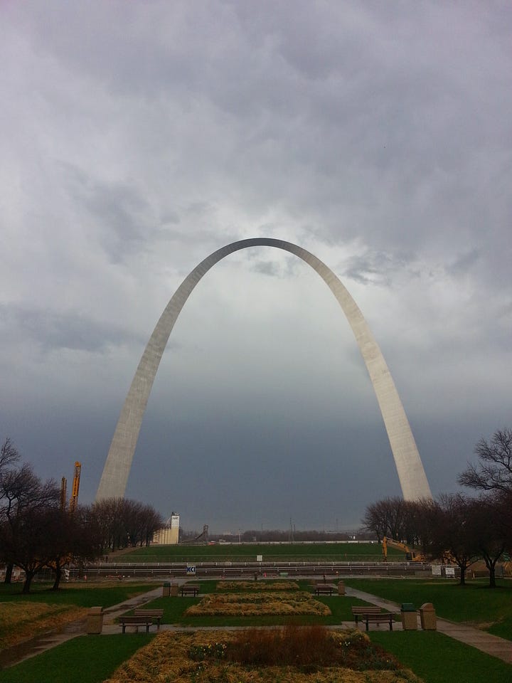 SL offering a bouquet to Picasso after our wedding. February 2011 & The Gateway Arch, April 2014