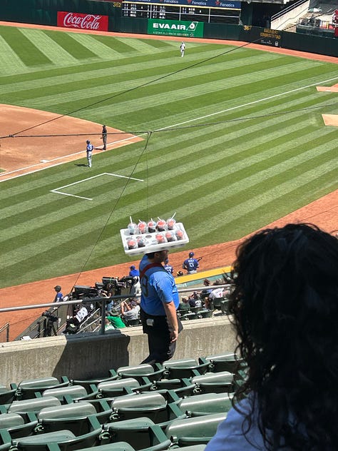 A 3 picture gallery including a large beer held up with the ball game in the background, a person selling snacks in the aisles of the stadium, and the Shibe Park Tavern, a stadium bar at the Oakland Coliseum