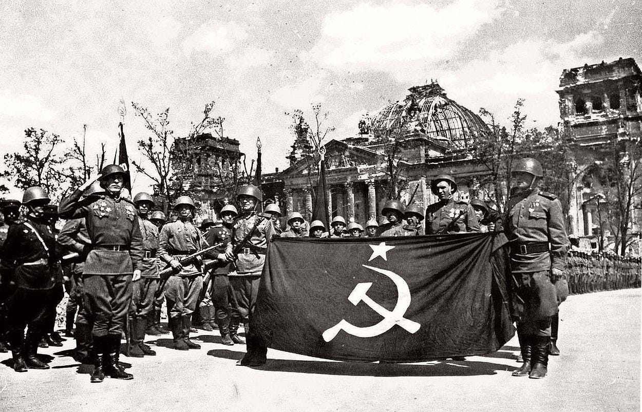 Iconic image of Soviet soldiers raising their victory banner in front of the destroyed Reichstag, marking the end of the Battle of Berlin in May 1945. Iconic image of Soviet soldiers raising their victory banner in front of the destroyed Reichstag, marking the end of the Battle of Berlin in May 1945.