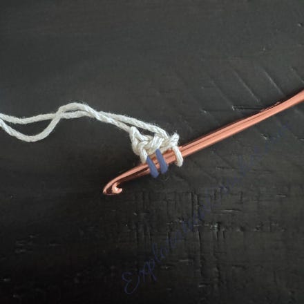 A crochet hook with a string

Description automatically generated