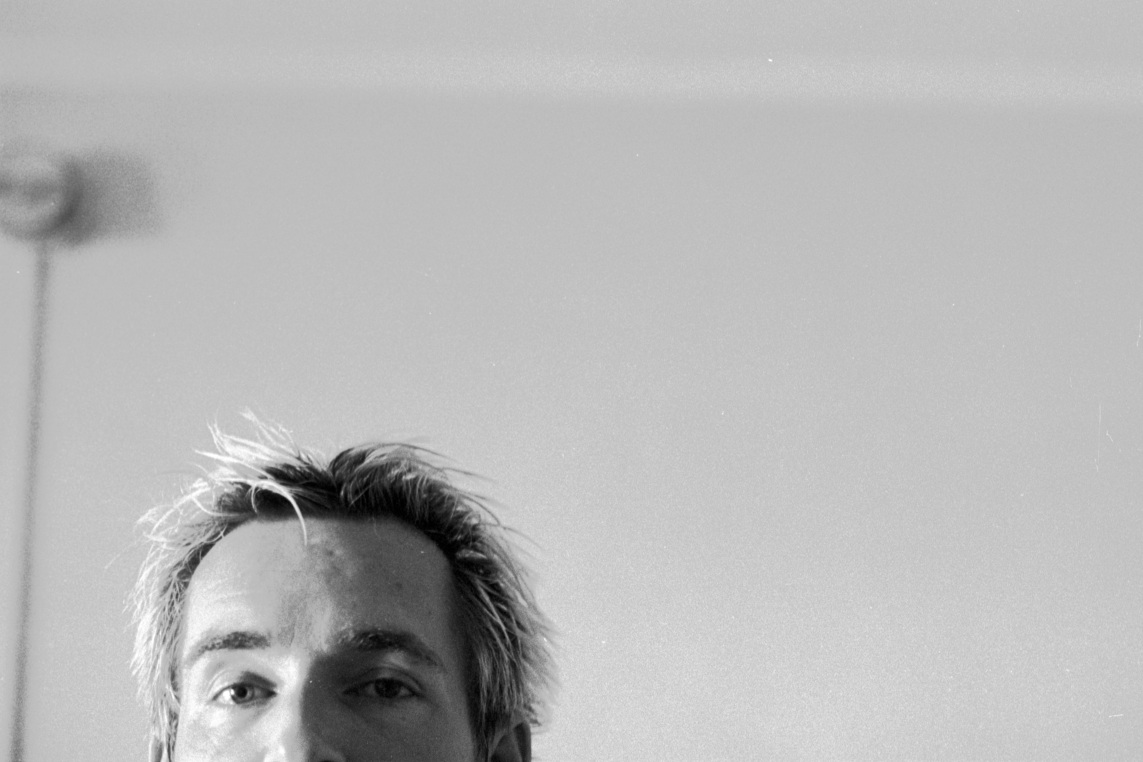 Black and white self portrait in a mirror.