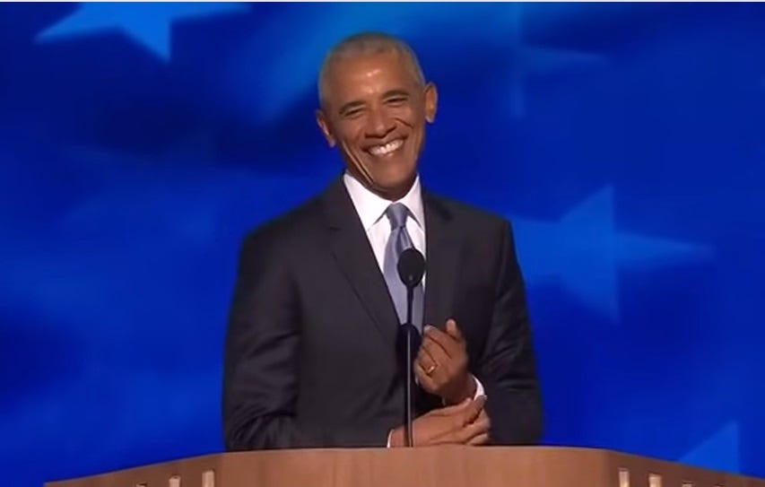 Barack Obama grins at the beginning of his speech at the DNC Barack Obama grins at the beginning of his speech at the DNC