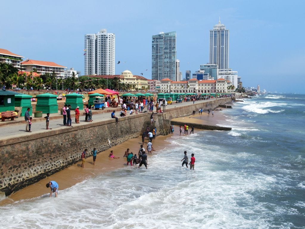 image of a small beach in colombo sri lanka with a rock wall stopping the water image of a small beach in colombo sri lanka with a rock wall stopping the water