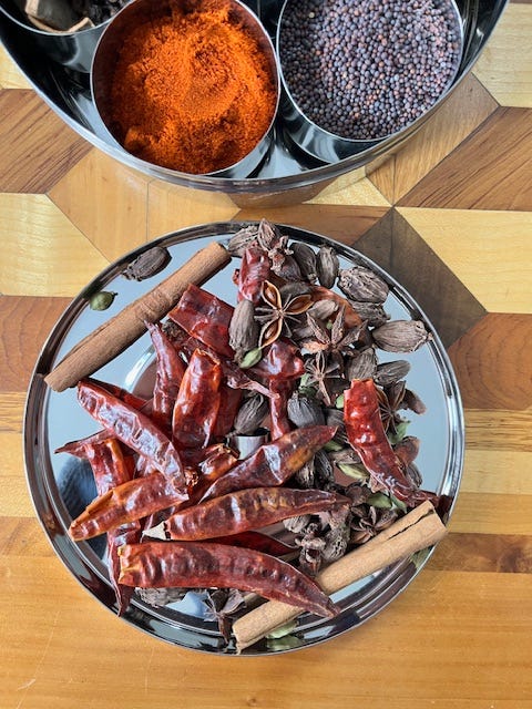 Four images of a stainless steel masala tin with seven spices suitable for Indian dishes and curries.