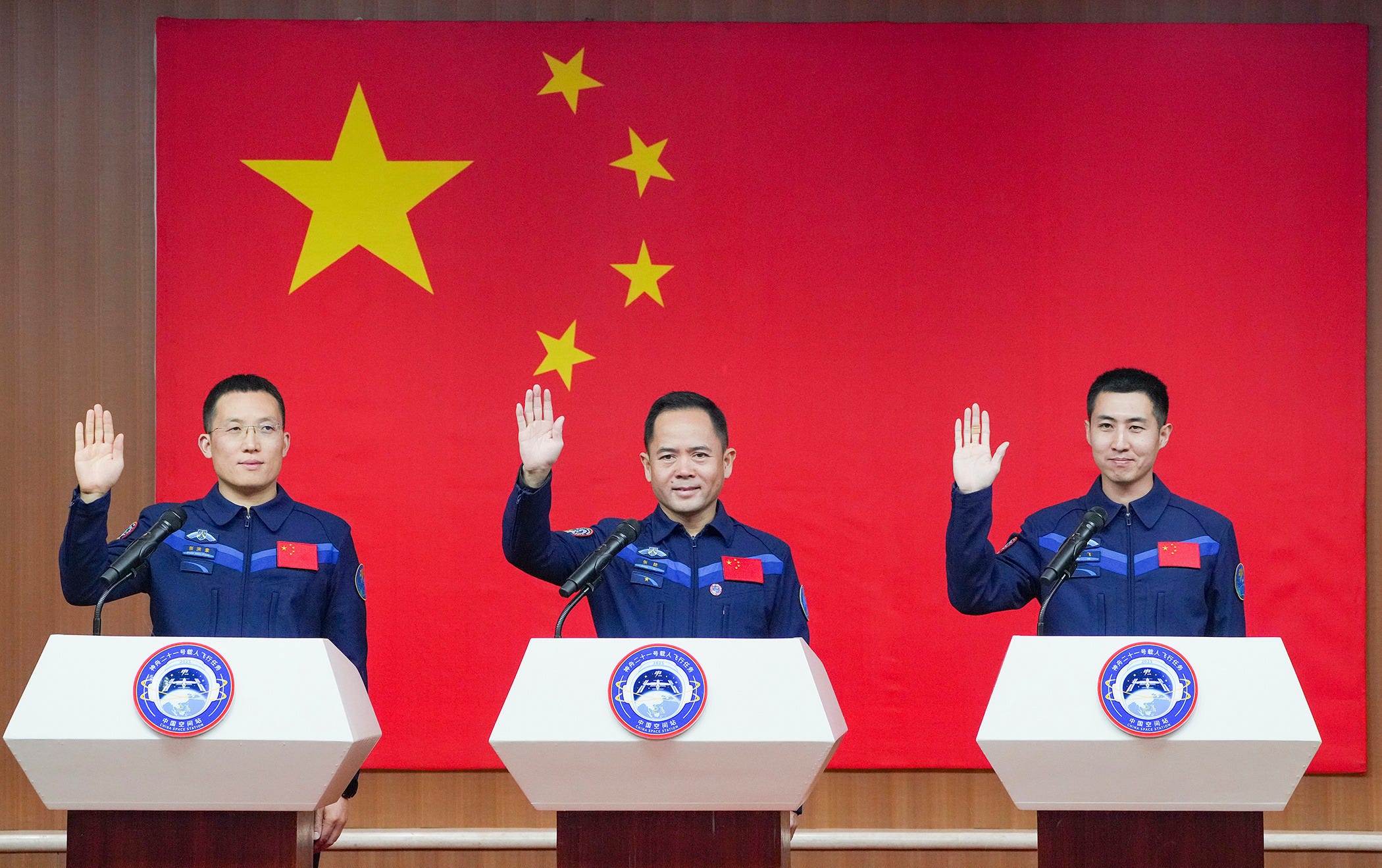 Taikonauts Zhang Hongzhang (left), Zhang Lu (center), and Wu Fei (right) meet the press ahead of the launch of the Shenzhou-21 mission. Taikonauts Zhang Hongzhang (left), Zhang Lu (center), and Wu Fei (right) meet the press ahead of the launch of the Shenzhou-21 mission.
