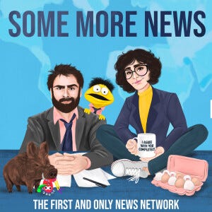 Animated versions of a man with a beard sitting at a news desk with a muppet behind him. An animated woman is sitting cross-legged next to him.