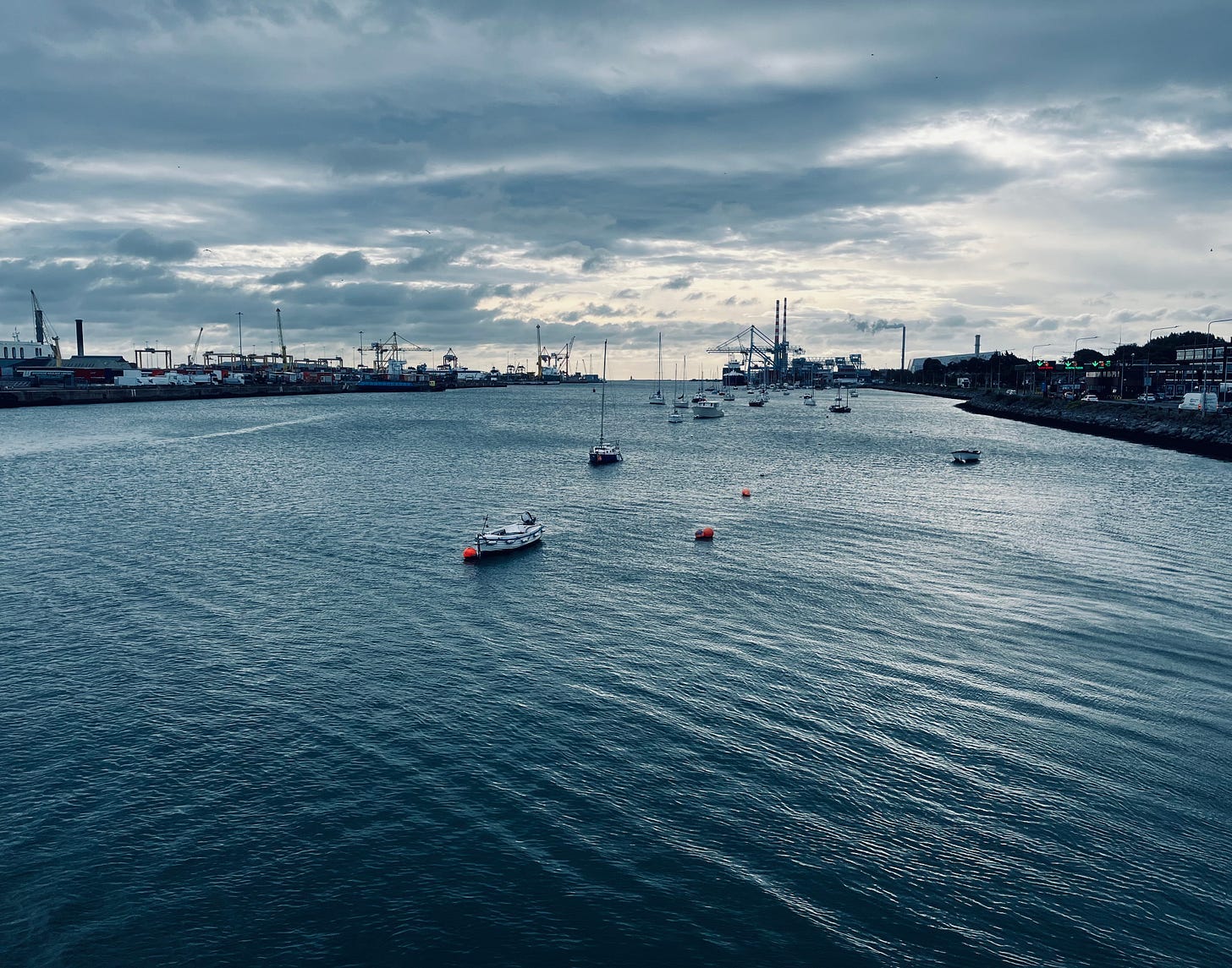 Boats in the water with boats

Description automatically generated