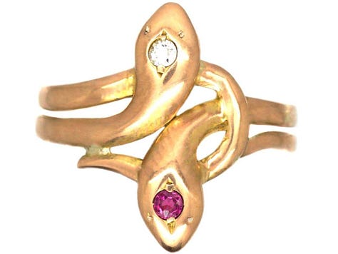 2 rings, one with a colourful green and orange stone, one sapphire, one snake 