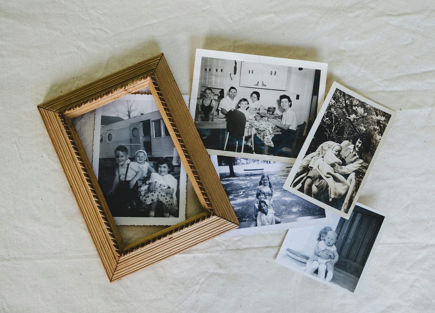 A group of photos sitting on top of a white sheet