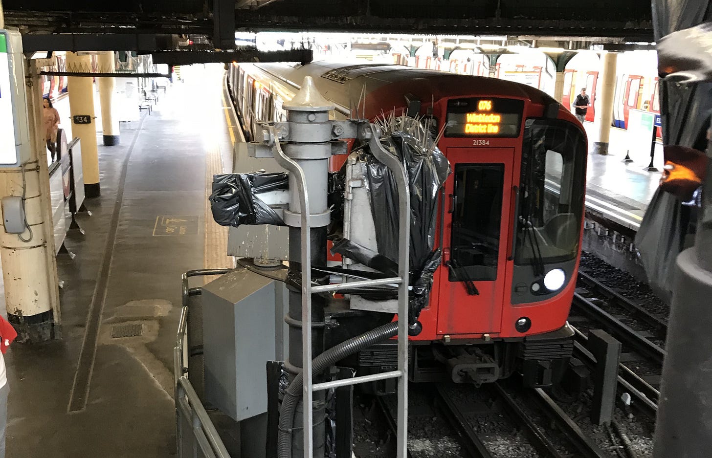 Photo of S stock train at Edgware Road with signalling equipment covered in black plastic. Photo of S stock train at Edgware Road with signalling equipment covered in black plastic.