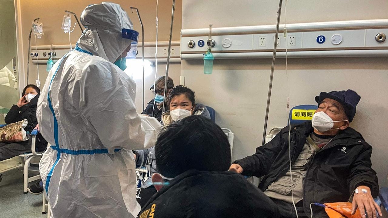 People receive medical attention in a Fever Clinic area in a Hospital in the Changning district in Shanghai, as China battles a wave of coronavirus infections that has hit the elderly hard. Picture: AFP People receive medical attention in a Fever Clinic area in a Hospital in the Changning district in Shanghai, as China battles a wave of coronavirus infections that has hit the elderly hard. Picture: AFP