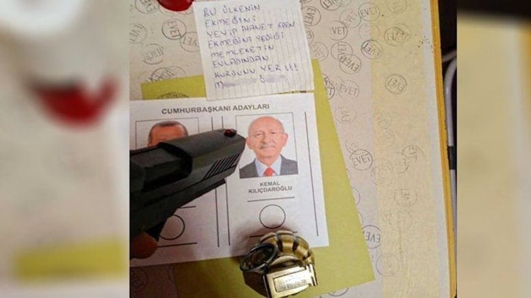 Oy kullanmaya silah ve bombayla girdi, tehdit etti