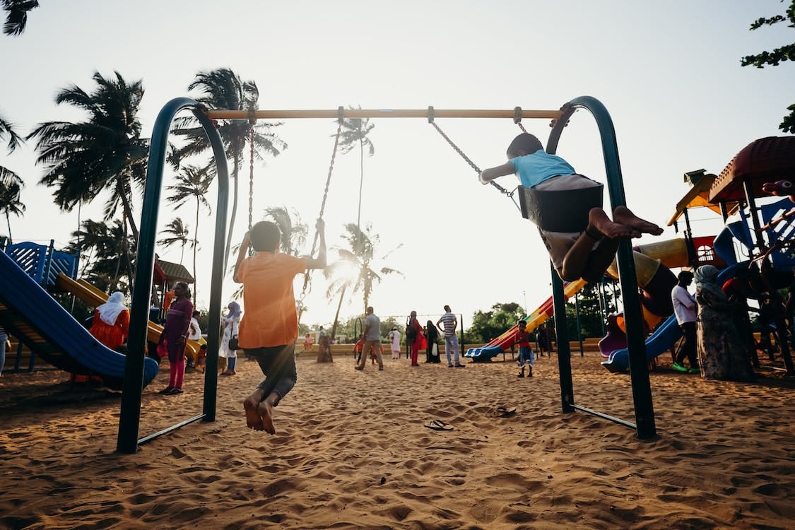 Free Children Playing on Swing Stock Photo Free Children Playing on Swing Stock Photo