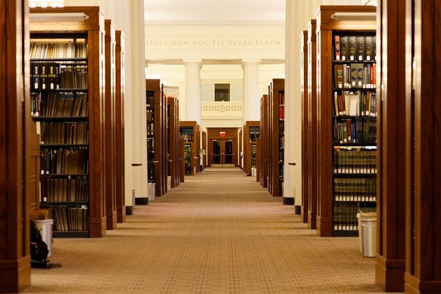 This may contain: an empty library filled with lots of books