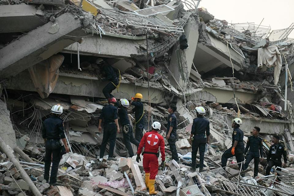 Rescuers search for survivors trapped in the collapsed Sky Villa Condominium building in Mandalay, Myanmar, on March 29, 2025, a day after an earthquake struck central Myanmar. Rescuers pulled a woman alive from the wreckage of a collapsed apartment building in Mandalay on March 29, AFP journalists saw, 30 hours after the quake.