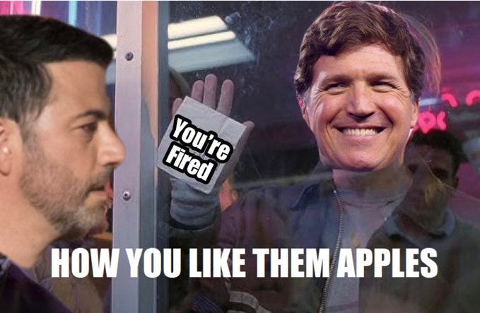 Jimmy Kimmel and Tucker Carlson in a scene resembling a movie or TV show setting, with a glass window between them. Tucker Carlson holds up a sign reading "You\'re Fired" with a hand gesture. Text overlay reads "HOW YOU LIKE THEM APPLES" in bold white letters.