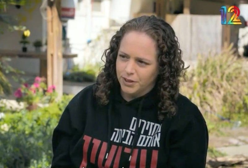 A woman speaks to camera
