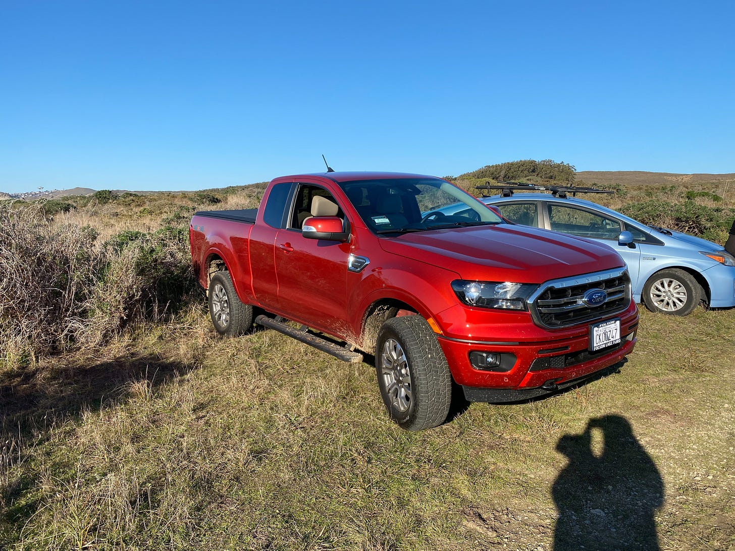 A red Ford Ranger 4x4 truck.