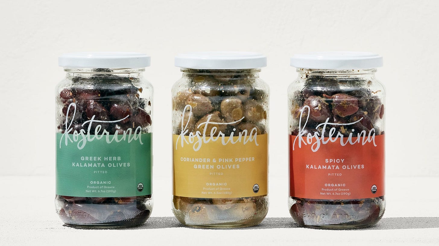 3 glass jars of Kosterina Kalamata Olives on a white background 3 glass jars of Kosterina Kalamata Olives on a white background