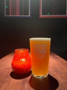 A pint of Whiplash with a candle inside Love Tempo A pint of Whiplash with a candle inside Love Tempo