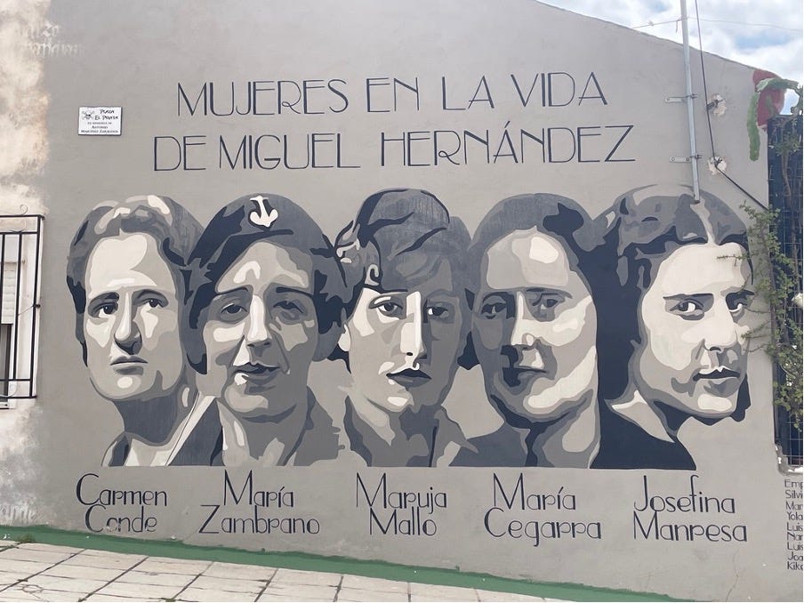 A mural of a row of women with their names written below them.