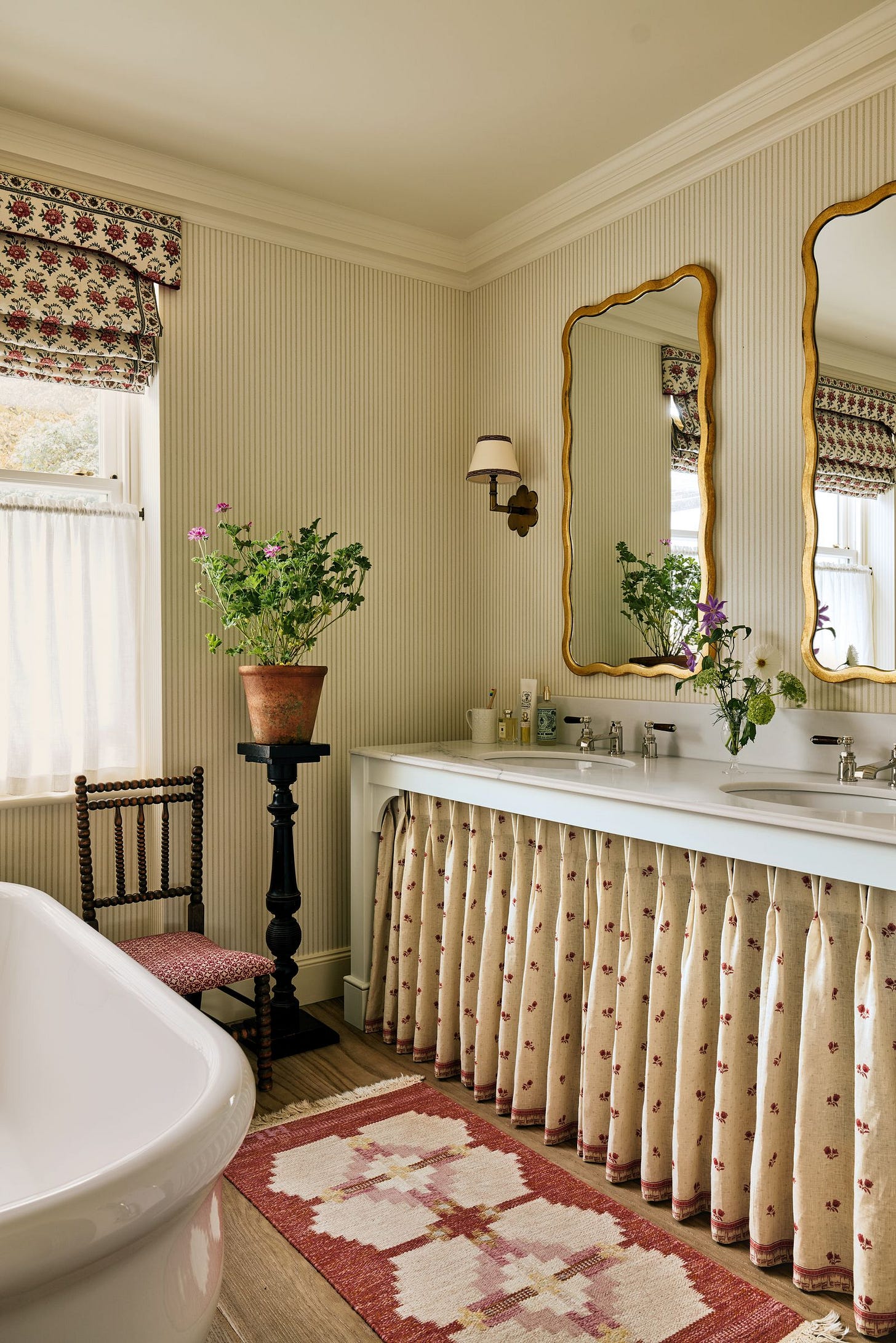Image may contain Chair Furniture Plant Indoors Interior Design Home Decor Rug Bathing Bathtub Person and Tub