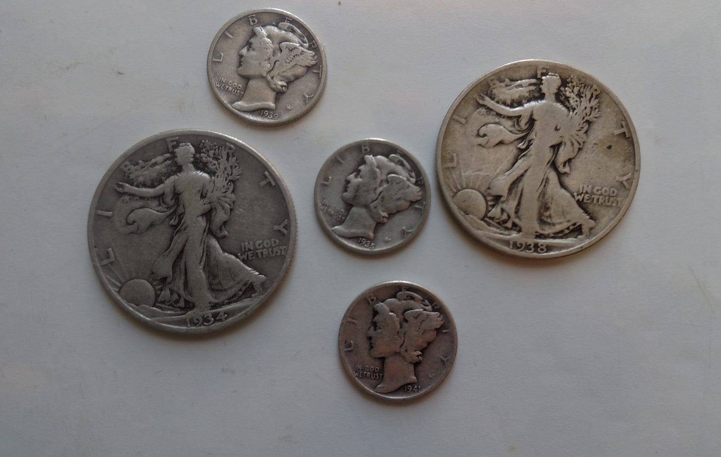 Silver coins found with a metal detector.