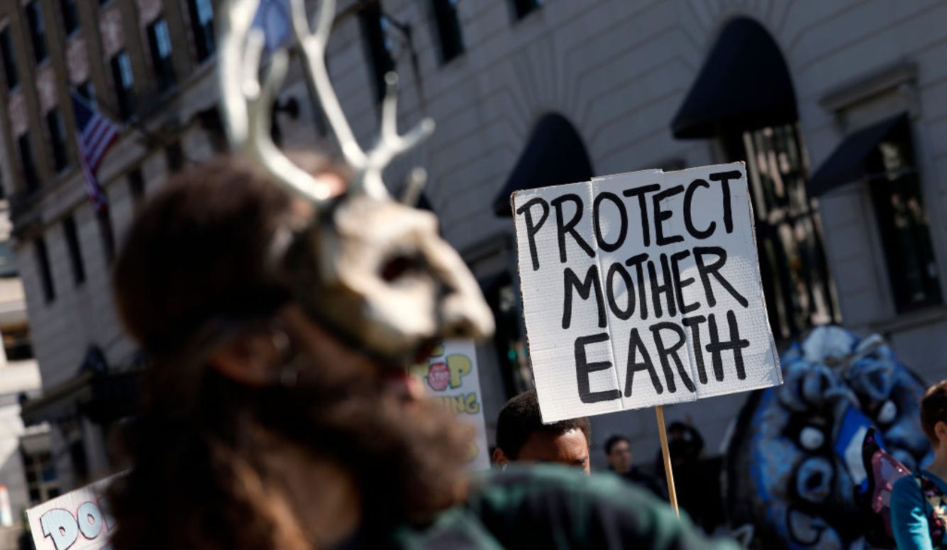 Man in a mask at an Earth Day rally. Man in a mask at an Earth Day rally.