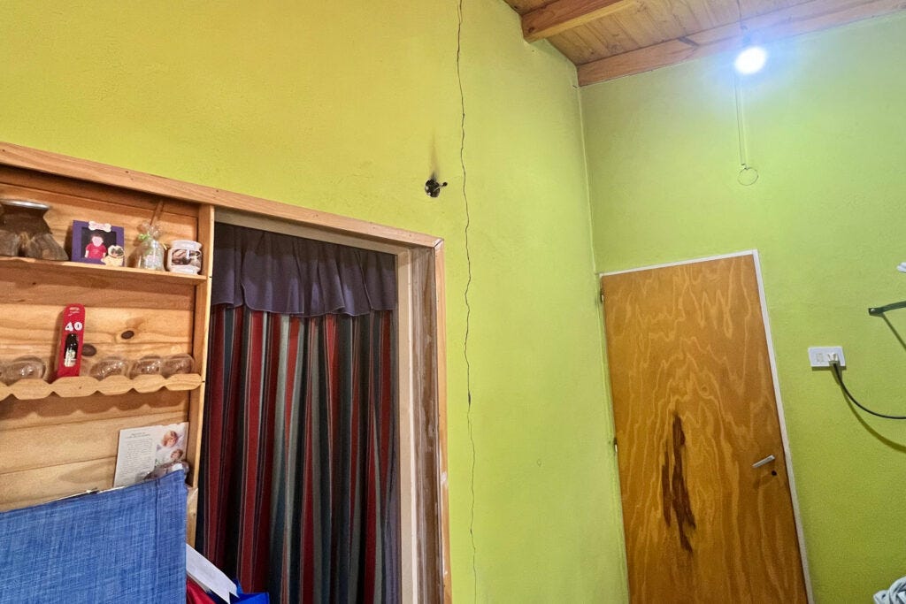 A cracked wall inside the Sauzal Bonito home of Noemi and Carlos Painevil. The Painevil's say the damage was caused by fracking-induced earthquakes. Credit: Katie Surma/Inside Climate News A cracked wall inside the Sauzal Bonito home of Noemi and Carlos Painevil. The Painevil's say the damage was caused by fracking-induced earthquakes. Credit: Katie Surma/Inside Climate News
