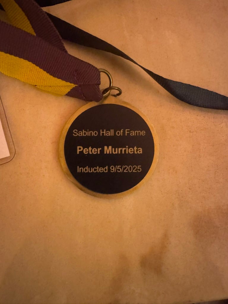 A medal with a ribbon

AI-generated content may be incorrect.