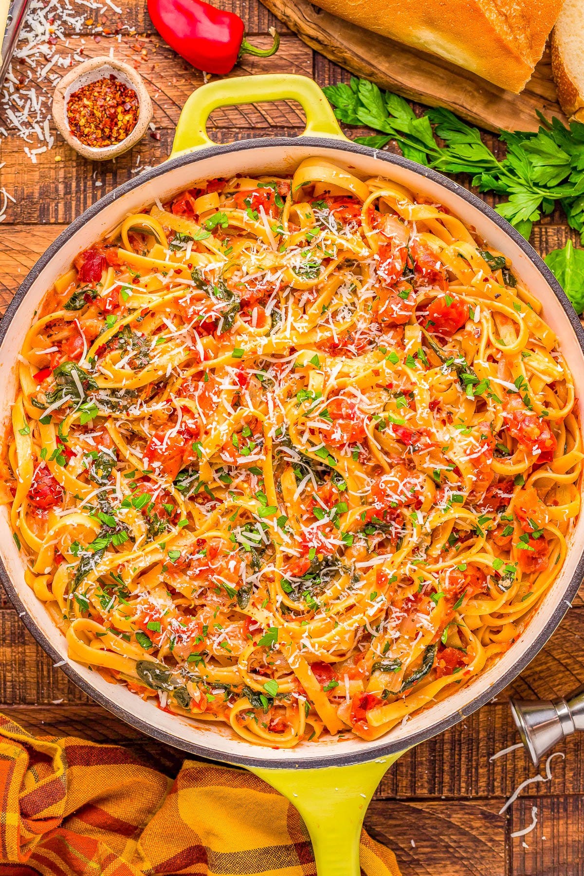 A pot of Pasta with Vodka Sauce topped with parmesan. 