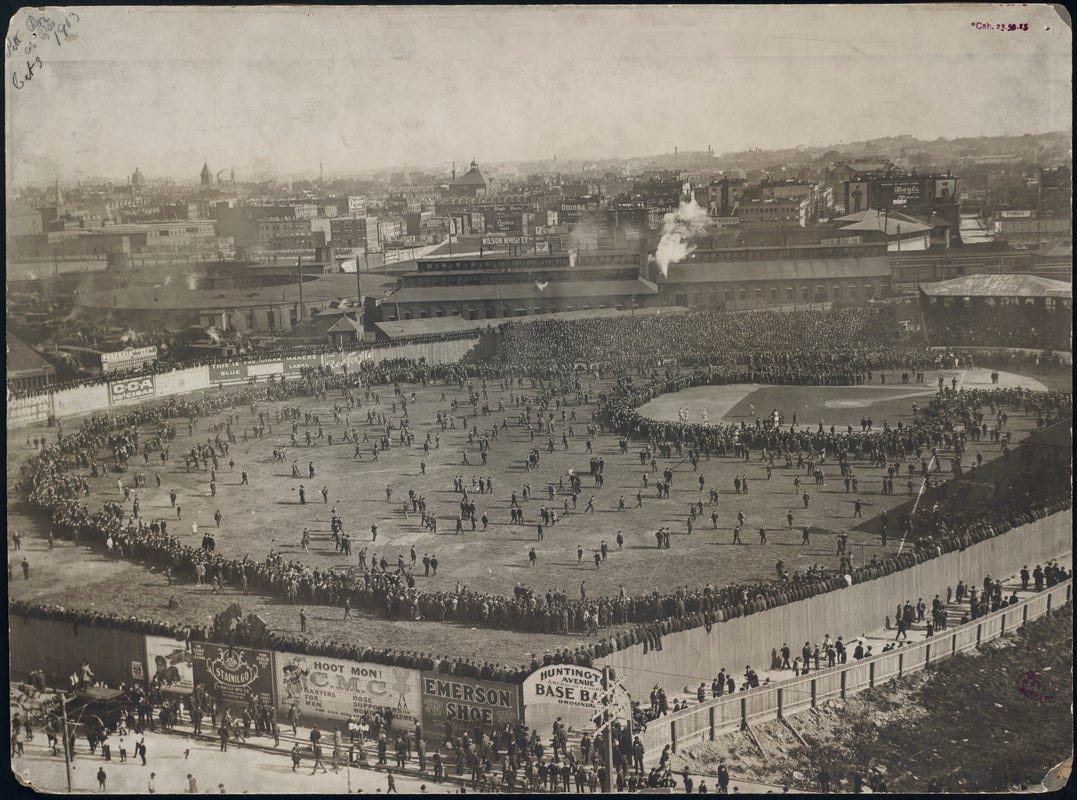 A huge crowd rings the infield and outfield of the Huntington Avenue Baseball Grounds. A huge crowd rings the infield and outfield of the Huntington Avenue Baseball Grounds.