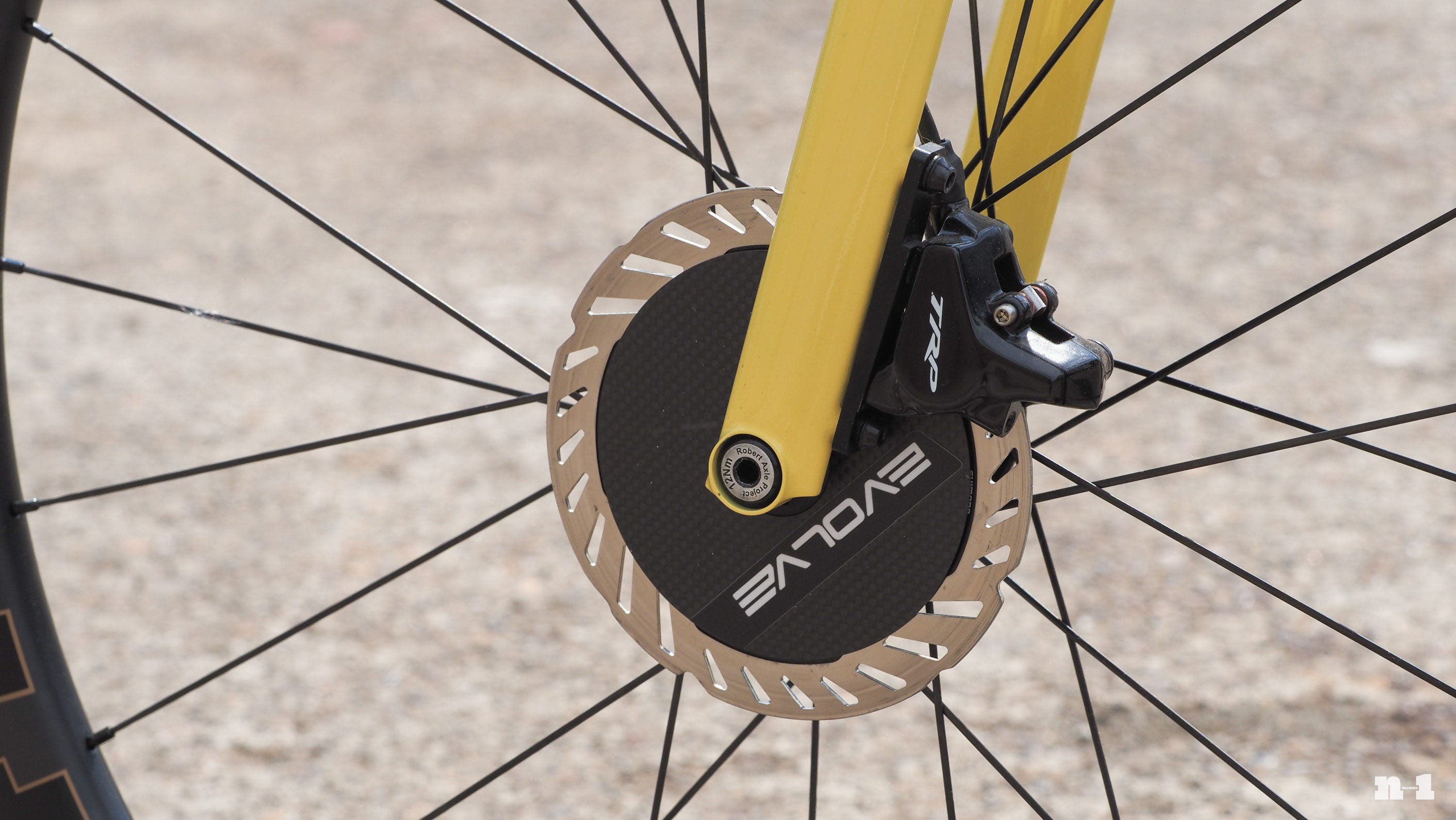 English Cycles yellow time trial bike Evolve front disc rotor