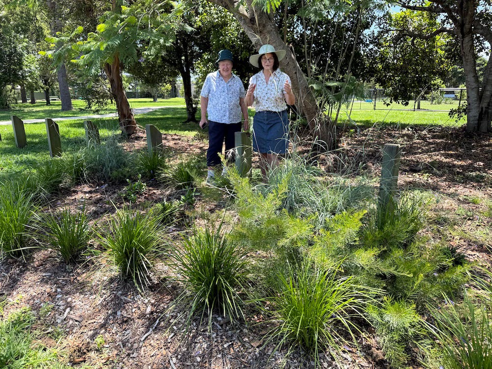 two women looking at the plants