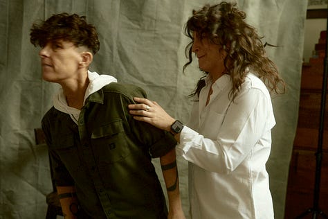 Three imagines of Meg and Andrea in dancing. In the final one, Andrea is moving toward the edge of the frame, and it appears Meg is trying to pull them back into it.