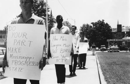 people holding signs people holding signs