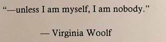 This may contain: an old typewriter with the words unless i am myself, i am nobody virginia woolf