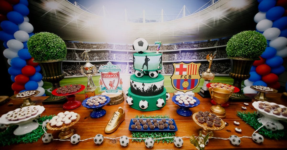Photo: Vidal Balielo Jr. / Pexels Vibrant football-themed dessert table with cake, sweets, and decorations for a birthday party.