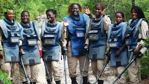 Mines Advisory Group A picture showing women de-miners in Angola waving to the camera