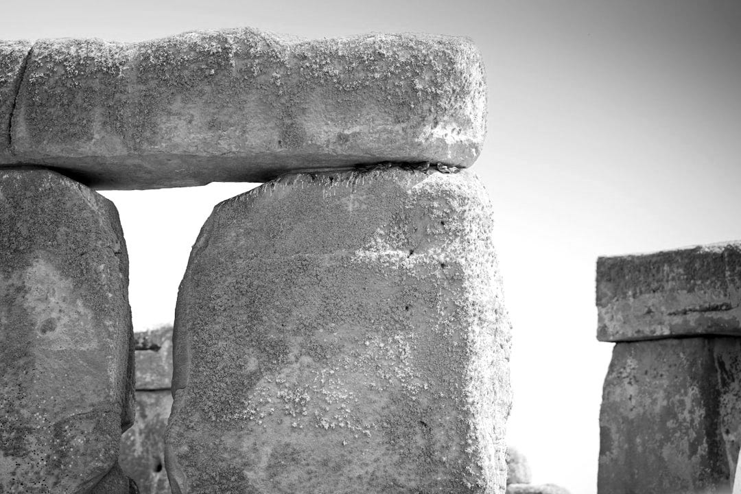 A close up of a stone structure with a sky background A close up of a stone structure with a sky background