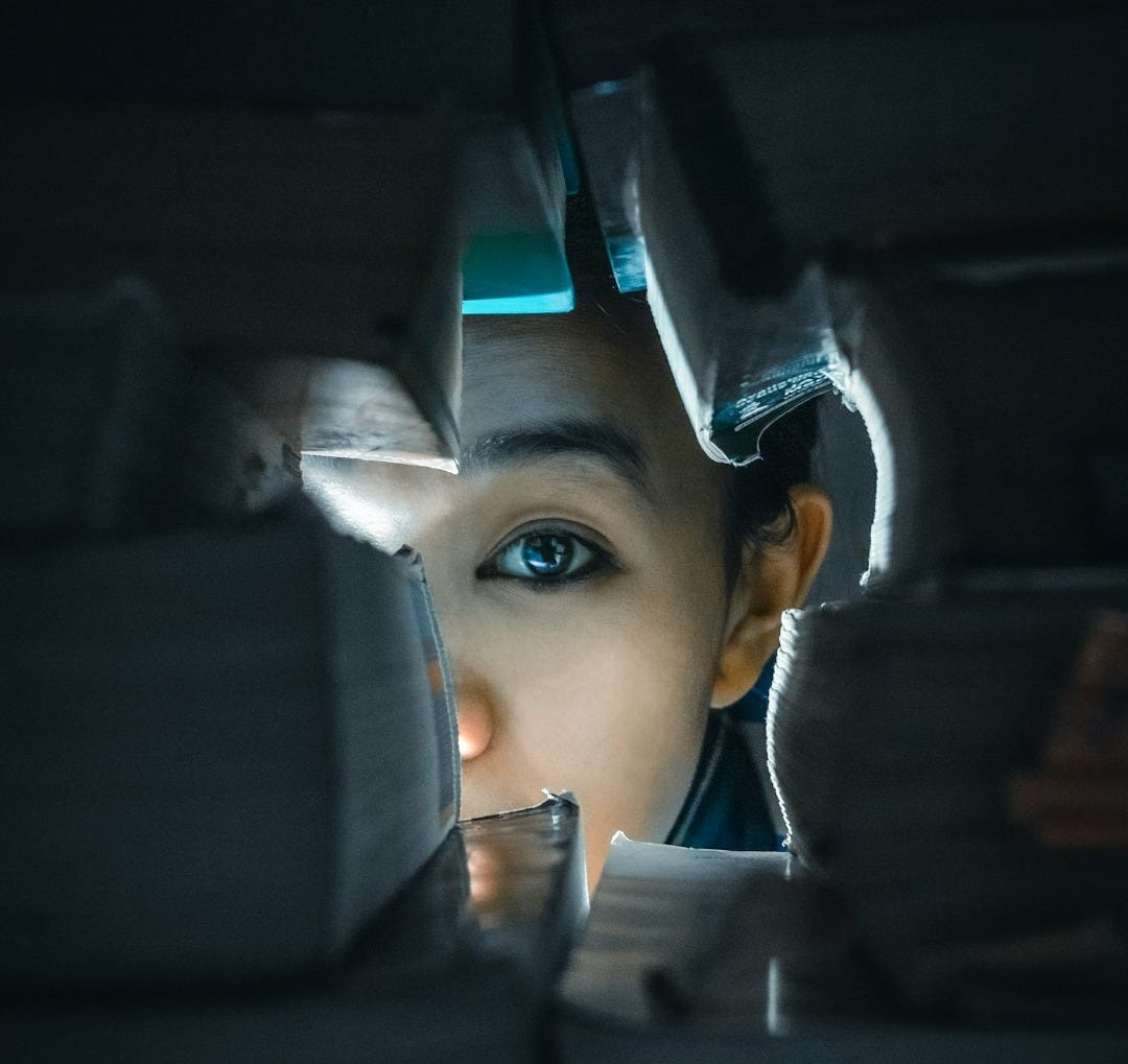 woman in black hijab taking selfie