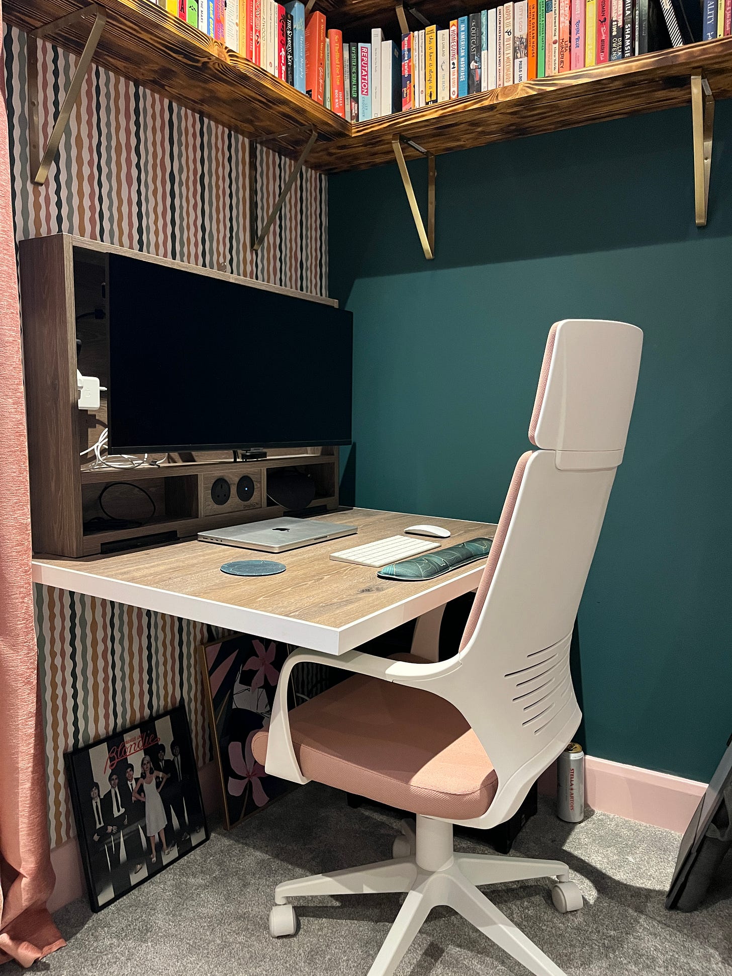 Hannah's new desk with a white and pink desk chair set up in front of it